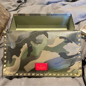 Pre-owned Valentino Rockstud camouflage clutch.   In great condition.